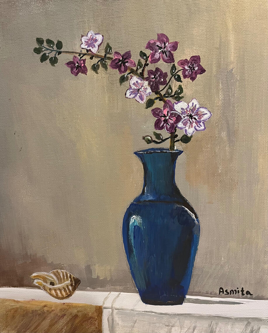 Cherry blossom branch in a blue vase