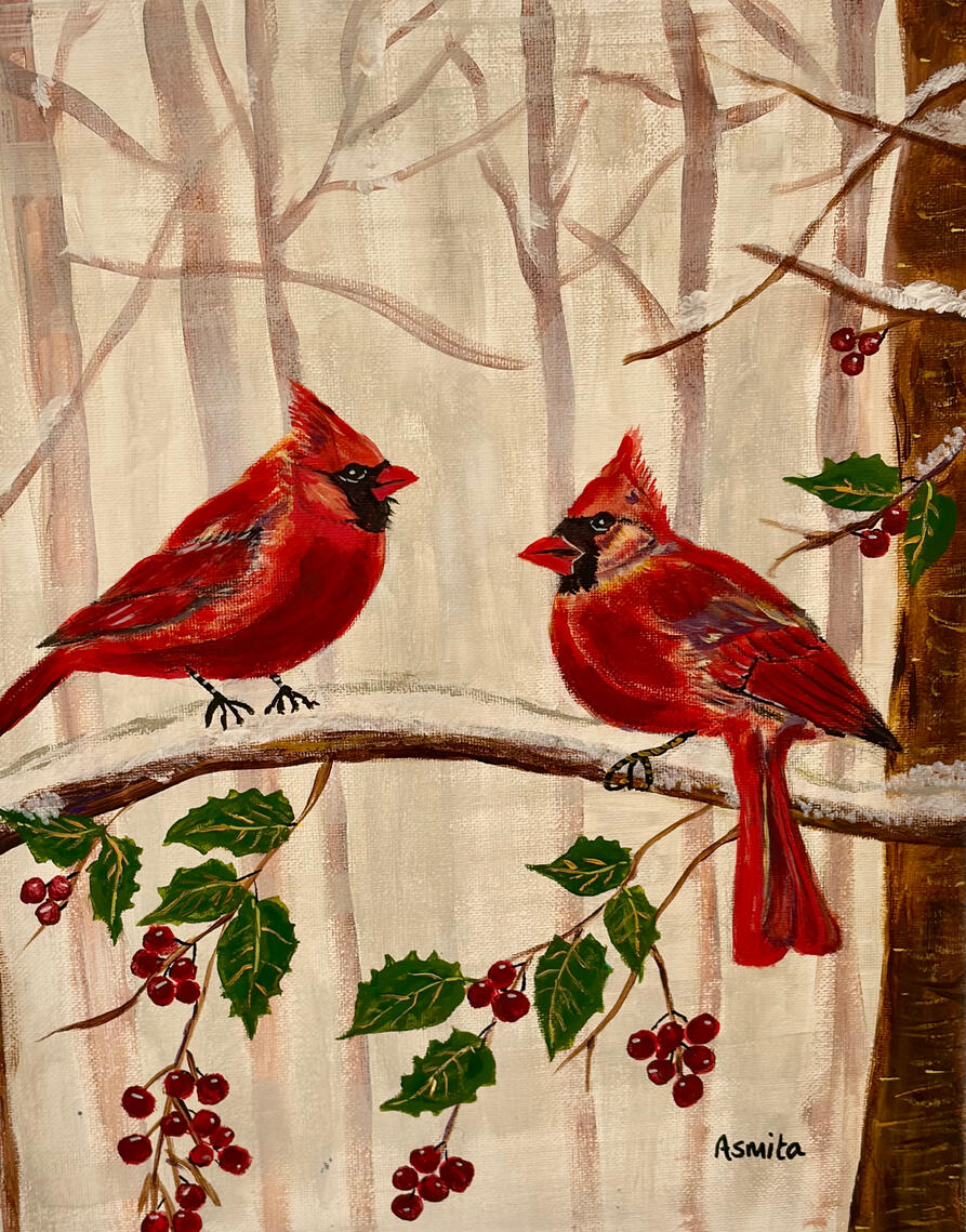 Two red cardinals on a branch